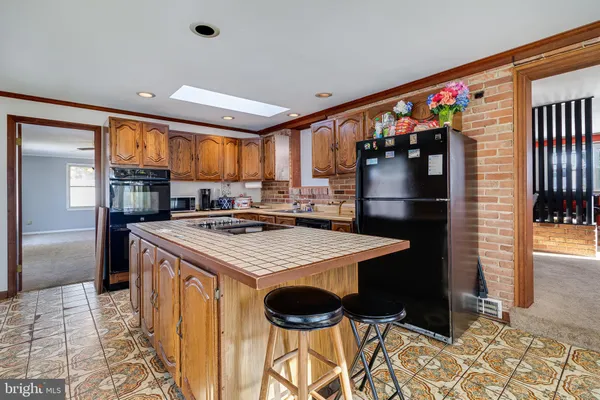 a kitchen that has a stove and a refrigerator