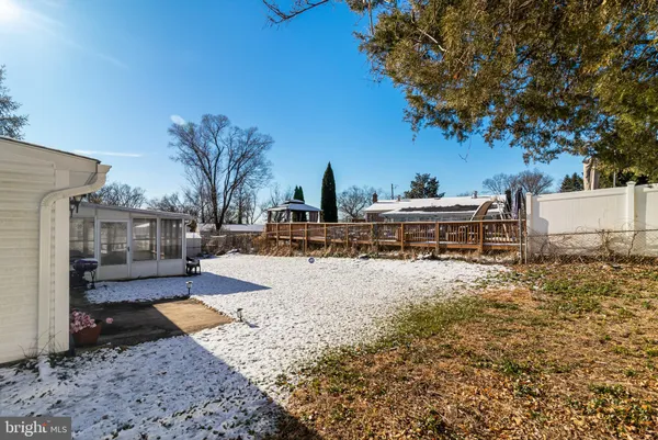 a view of a backyard with large trees