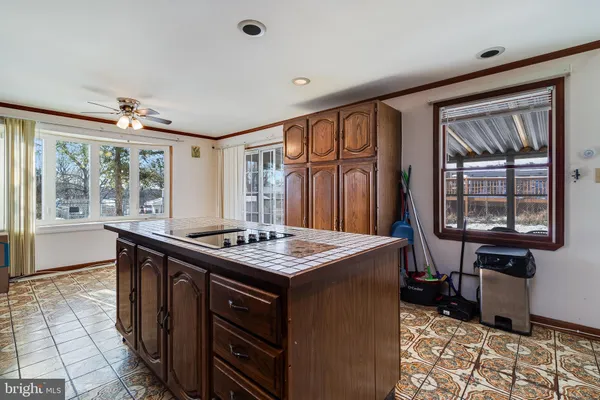 a kitchen that has a sink and a stove