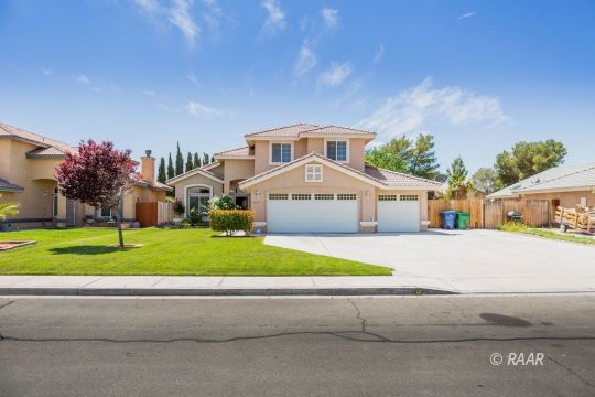 1129 Rebecca Avenue Ridgecrest, CA 93555 - Photo 1 of 34 a front view of house with yard and green space