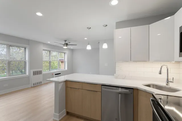 a kitchen with a sink and large window