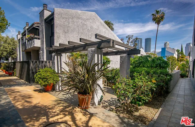 a street view with tall buildings