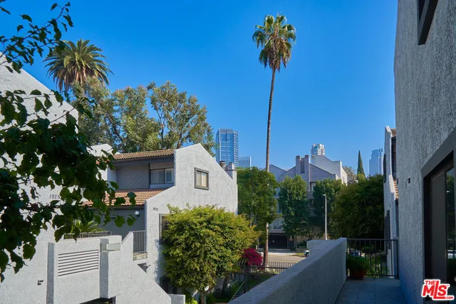 a view of a chairs and table in backyard