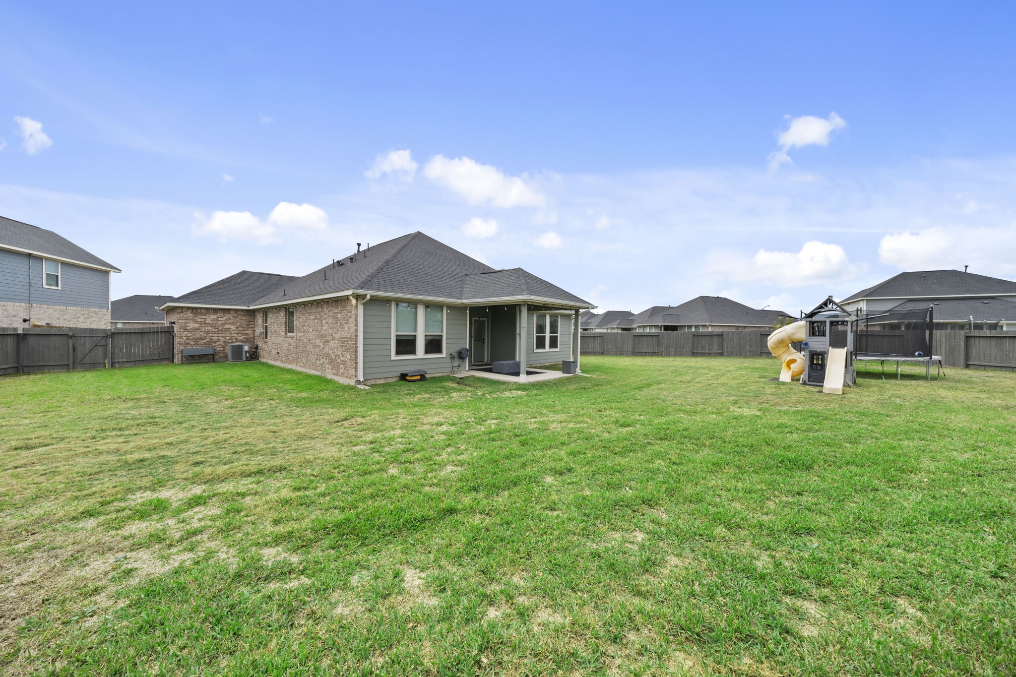 7703 Cowdray Lane Fulshear, TX 77441 - Photo 14 of 15 a view of a house with a yard