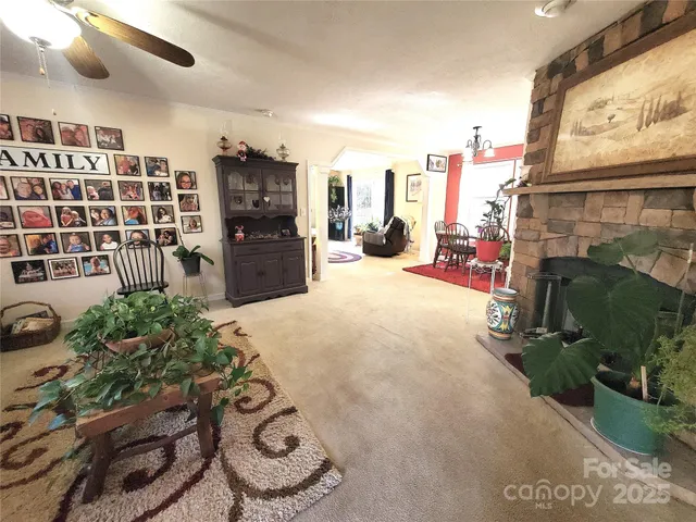 a view of a chairs and potted plant in front of a building