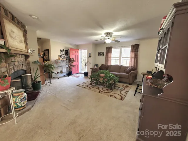 a view of a livingroom with furniture and a flat screen tv