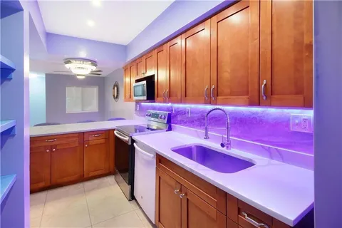 a spacious bathroom with a double vanity sink and a mirror