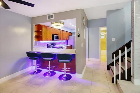 a very nice looking bedroom with a bed and a ceiling fan