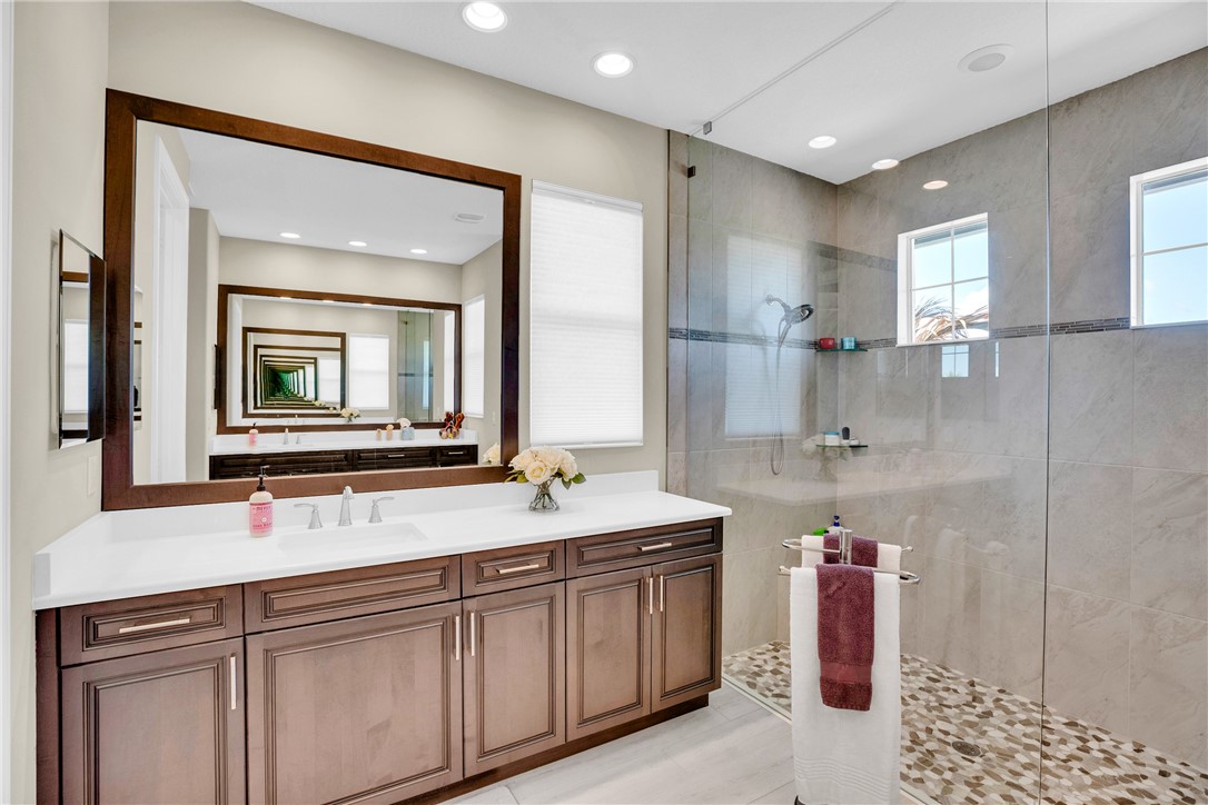 105 Night Hawk Way Sebastian, FL 32958 - Photo 18 of 36 a bathroom with a granite countertop sink mirror and double