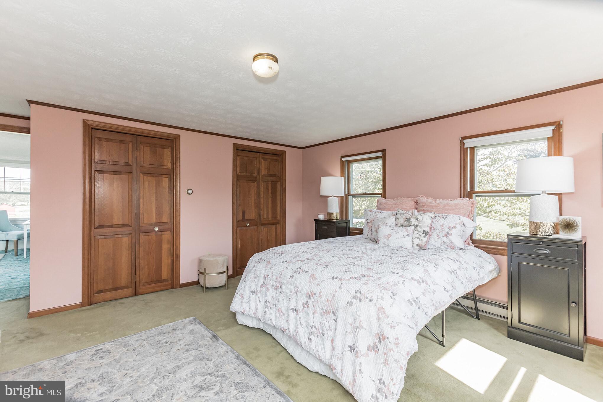 28814 Kemptown Road Damascus, MD 20872 - Photo 23 of 49 a bedroom with a bed and a dresser