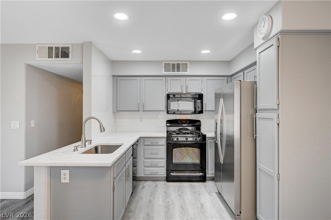 3425 East Russell Road, Unit 223 Las Vegas, NV 89120 - Photo 3 of 47 Newly renovated kitchen boasts stainless steel appliances, ample storage, and sleek countertops.