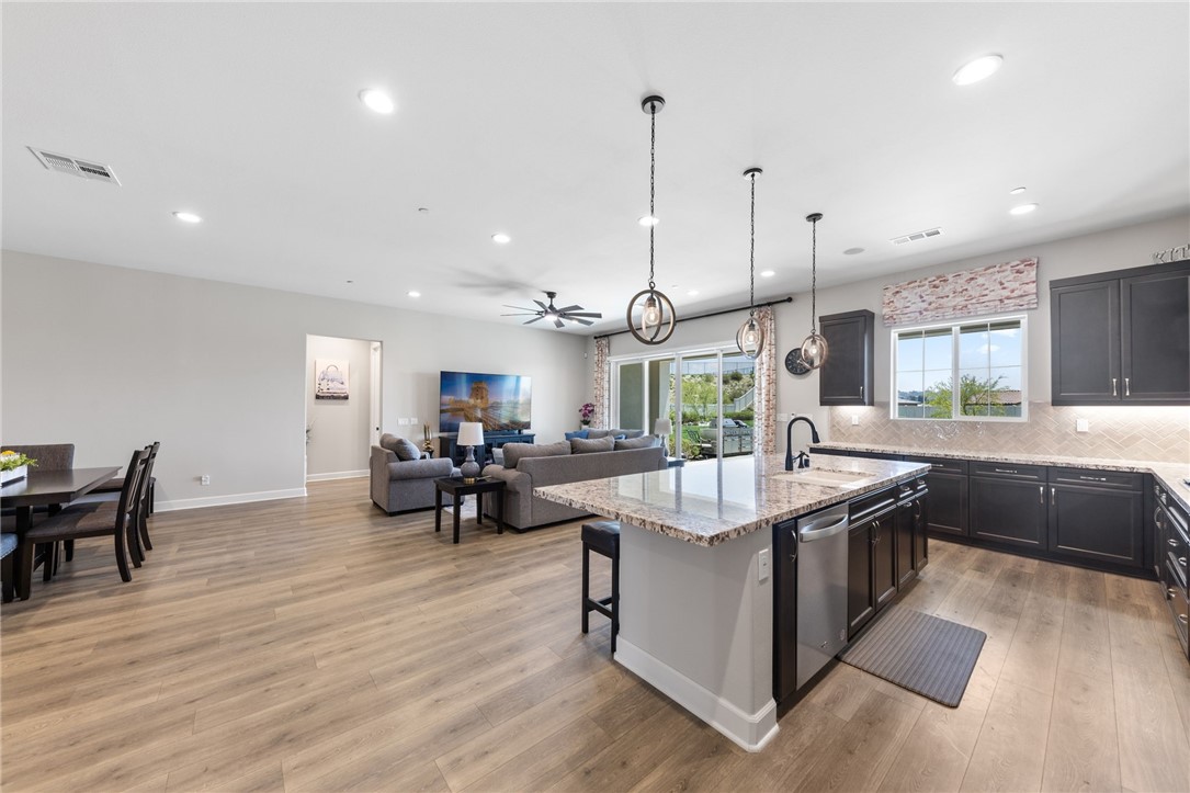 7631 Capstone Court Riverside, CA 92506 - Photo 12 of 39 Spacious kitchen island with seating and generous prep space.