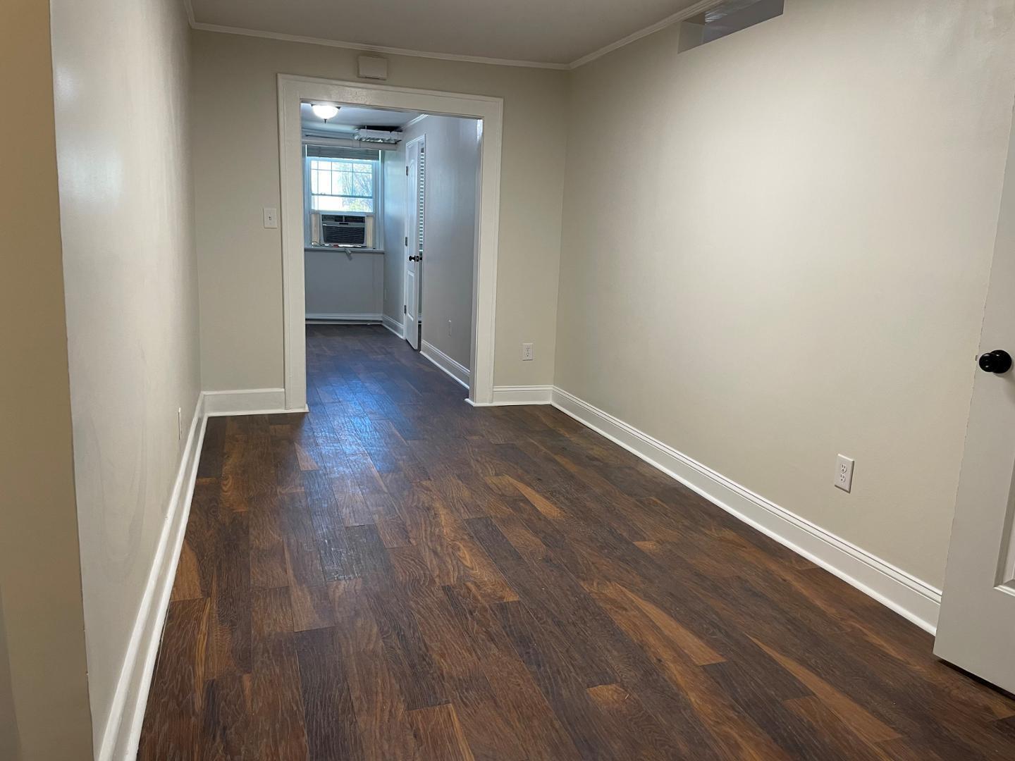 200 East Edenton Street, Unit 11 Raleigh, NC 27601 - Photo 3 of 9 a view of a room with wooden floor
