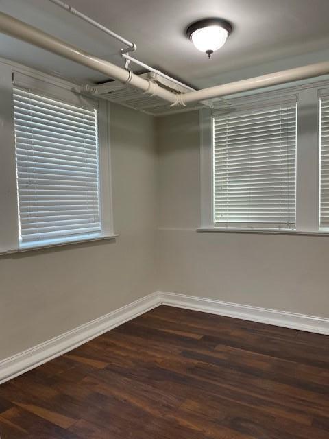 200 East Edenton Street, Unit 11 Raleigh, NC 27601 - Photo 7 of 9 a view of an empty room with wooden floor and a window