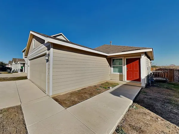 a front view of a house with parking space