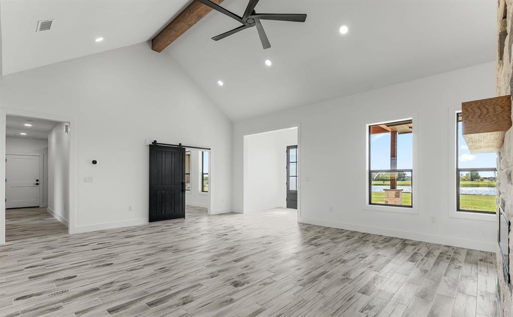 2311 Parker Road Wichita Falls, TX 76310 - Photo 12 of 32 a view of an empty room with window and wooden floor