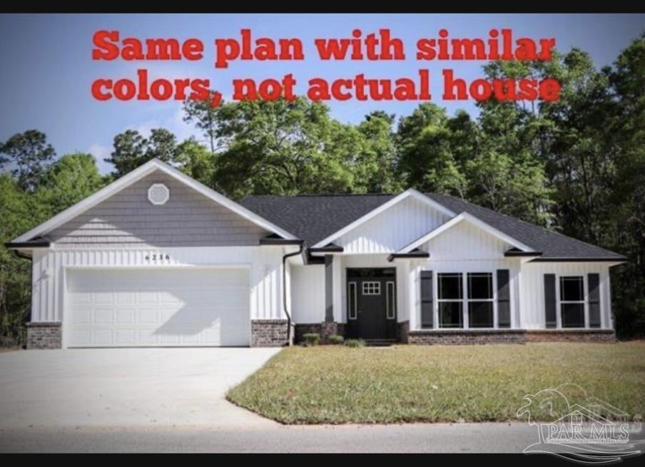 a house with lots of trees in the background