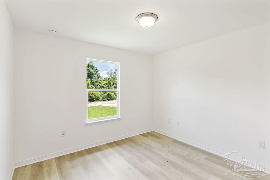 5594 Wiley Scott Road Jay, FL 32565 - Photo 13 of 22 an empty room with window