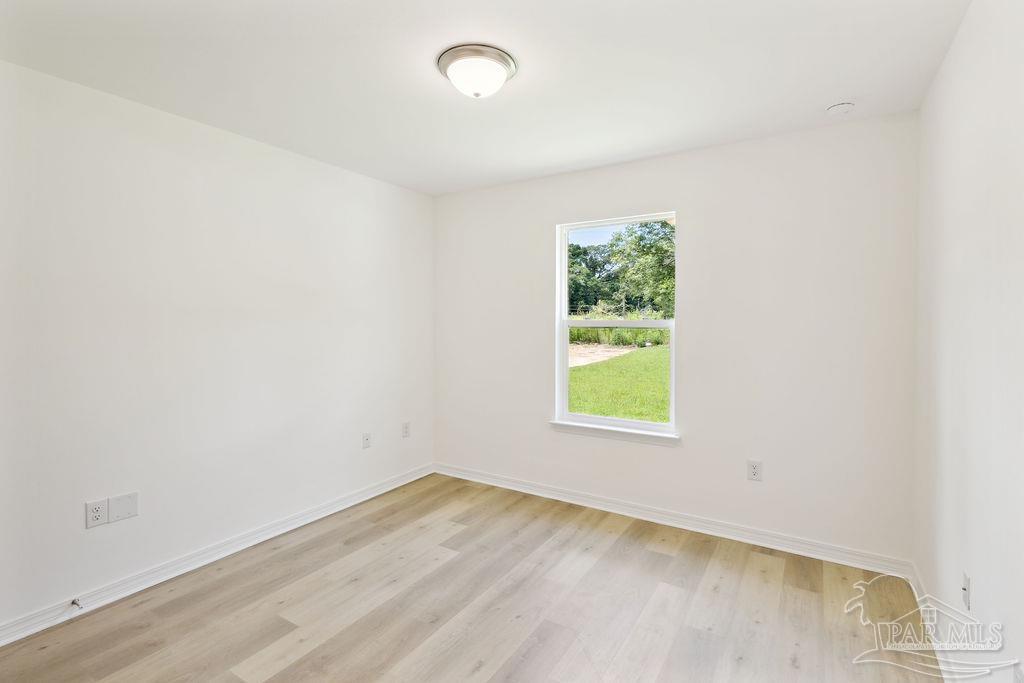 5594 Wiley Scott Road Jay, FL 32565 - Photo 20 of 22 an empty room with a window
