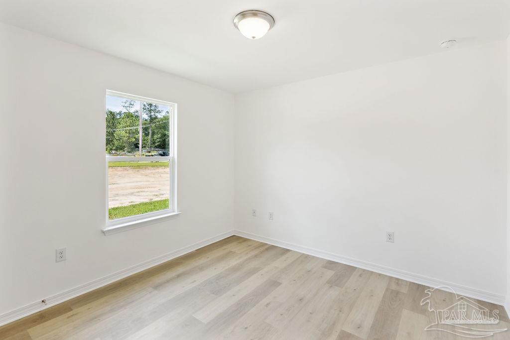 5594 Wiley Scott Road Jay, FL 32565 - Photo 7 of 22 an empty room with a window