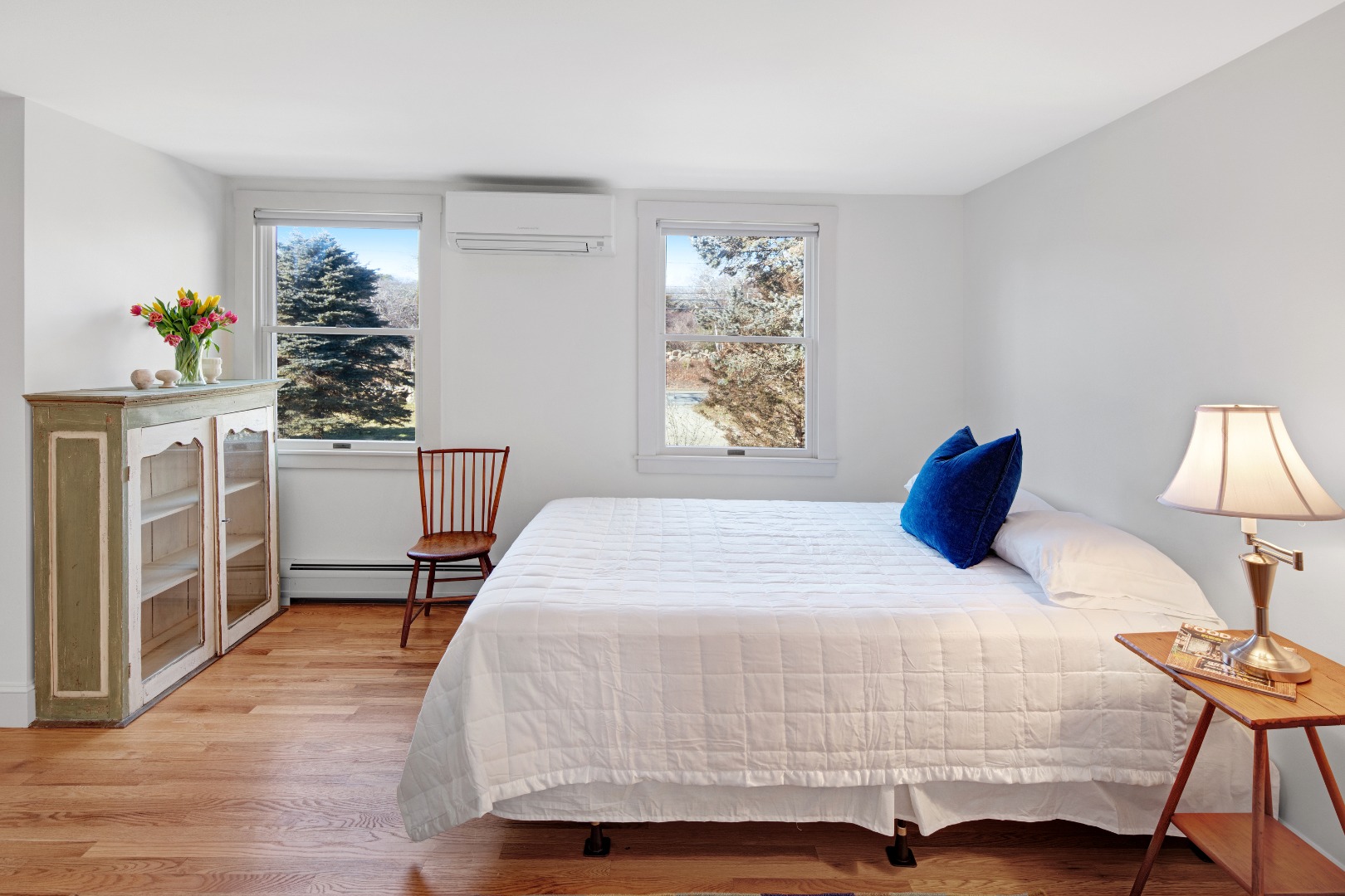 276 S Road Chilmark, MA 02535 - Photo 17 of 39 a bedroom with a bed and a lamp on table