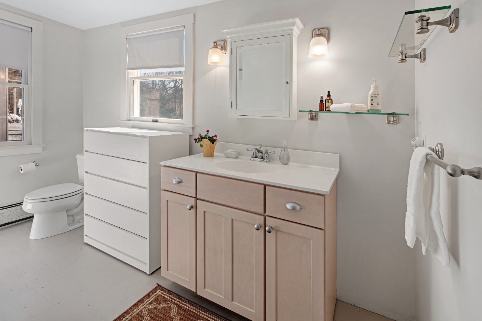 276 S Road Chilmark, MA 02535 - Photo 20 of 39 a bathroom with a sink toilet vanity and mirror