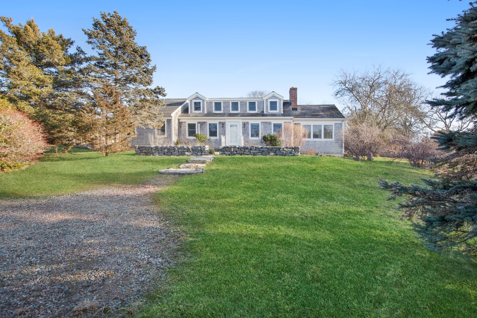 276 S Road Chilmark, MA 02535 - Photo 32 of 39 a view of a house with a big yard and large trees