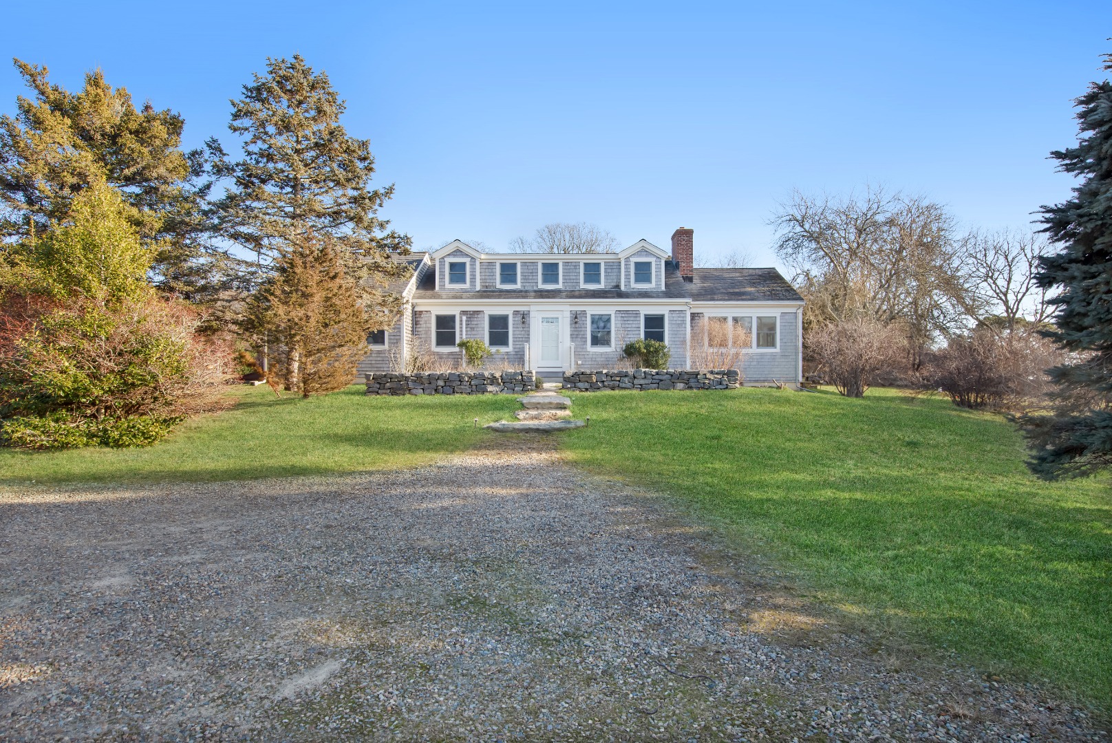 276 S Road Chilmark, MA 02535 - Photo 33 of 39 a view of a house with a yard and sitting area