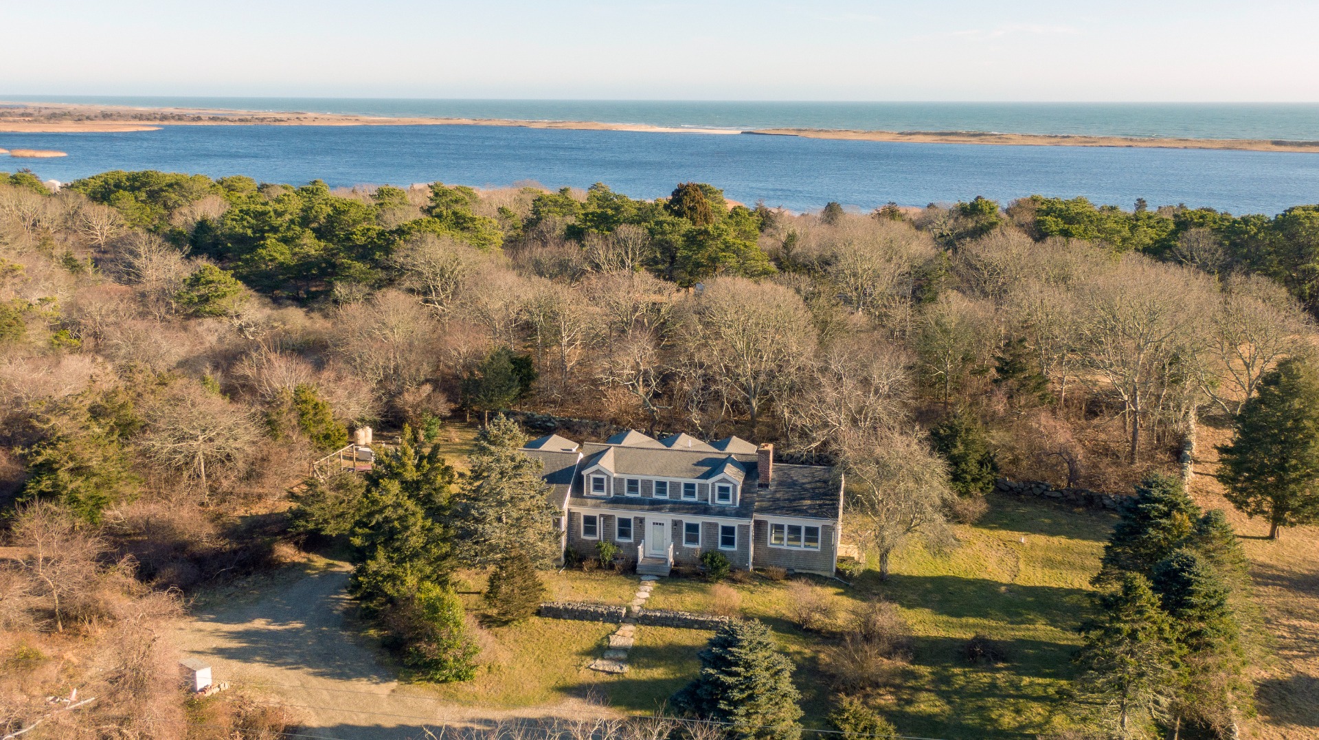 276 S Road Chilmark, MA 02535 - Photo 36 of 39 a view of a lake with a mountain in the background