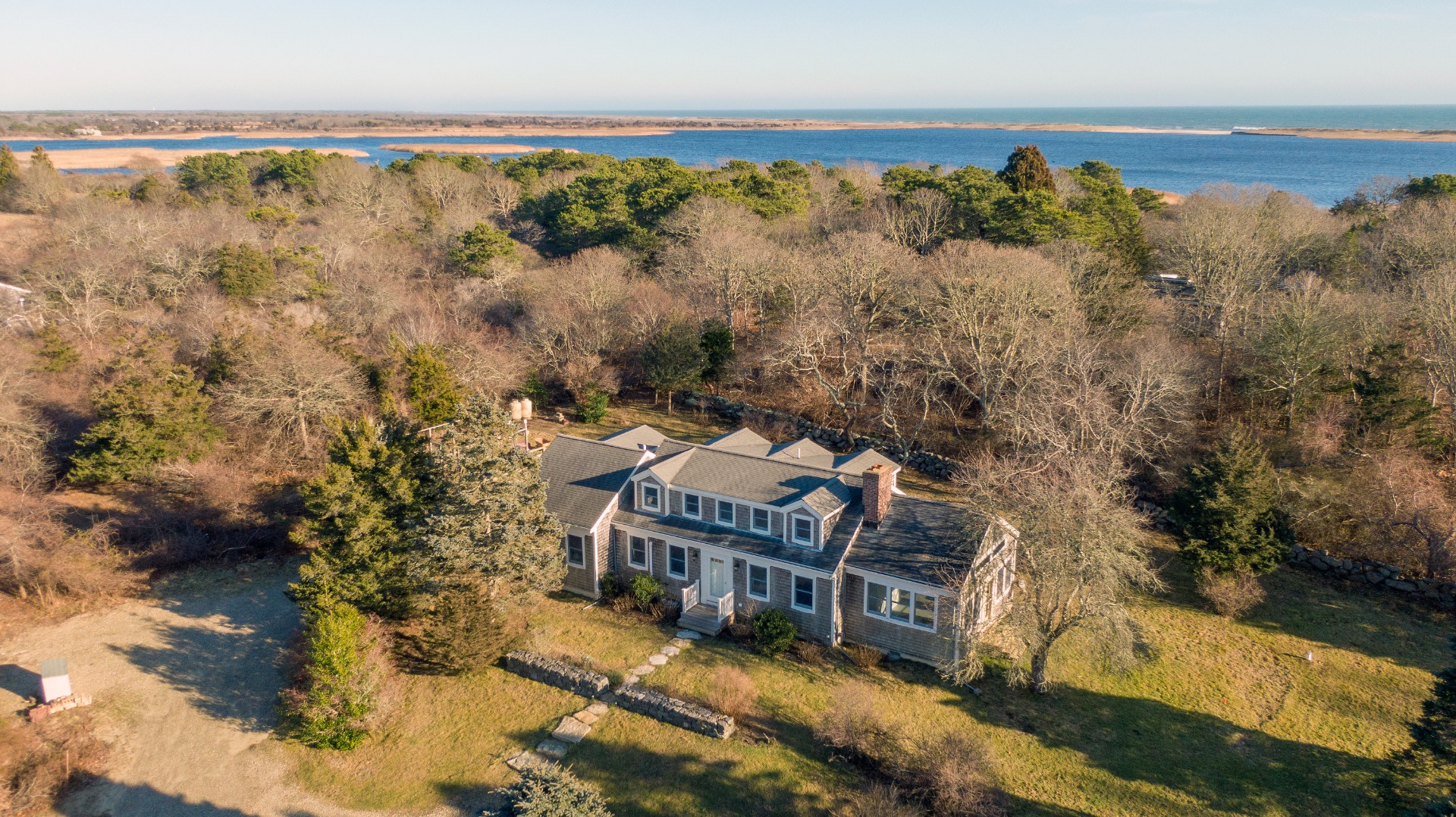 276 S Road Chilmark, MA 02535 - Photo 37 of 39 a view of a house with a yard and lake view
