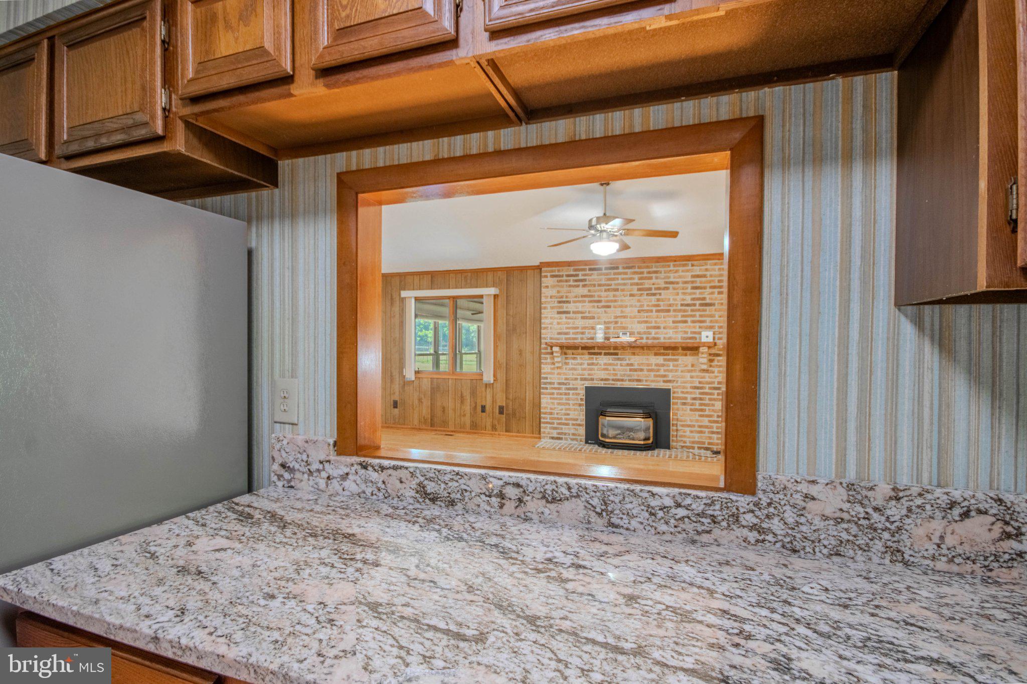 31749 Morris Leonard Road Parsonsburg, MD 21849 - Photo 10 of 40 Charming kitchen view to cozy living room.