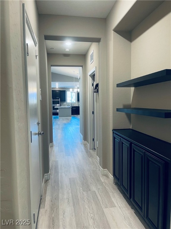 930 Bayberry Ridge Street Henderson, NV 89052 - Photo 21 of 40 Corridor featuring light wood-type flooring and baseboards