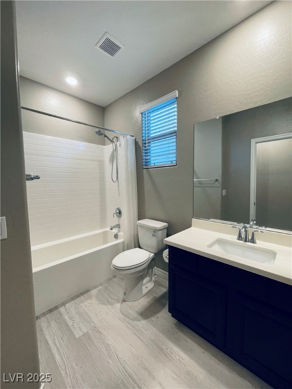 930 Bayberry Ridge Street Henderson, NV 89052 - Photo 23 of 40 Bathroom featuring shower / bath combo with shower curtain, vanity, and light wood-type flooring