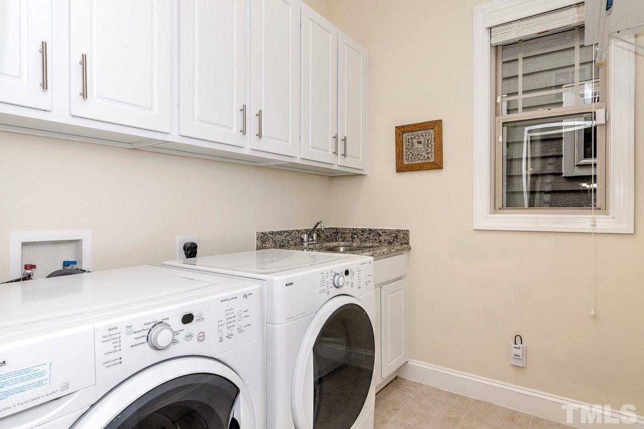1409 Rodessa Run Raleigh, NC 27607 - Photo 13 of 25 a utility room with dryer and washer