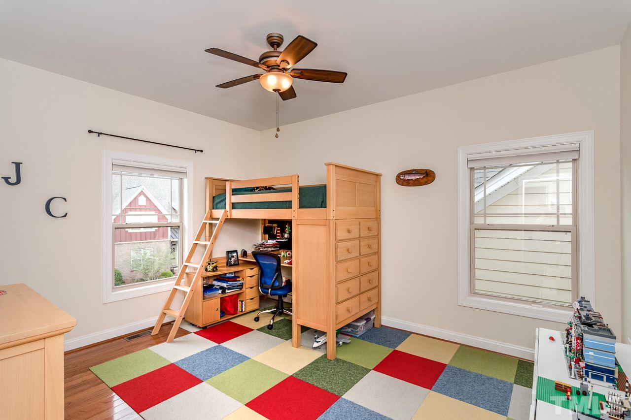 1409 Rodessa Run Raleigh, NC 27607 - Photo 18 of 25 a view of a room with gym equipment and a window