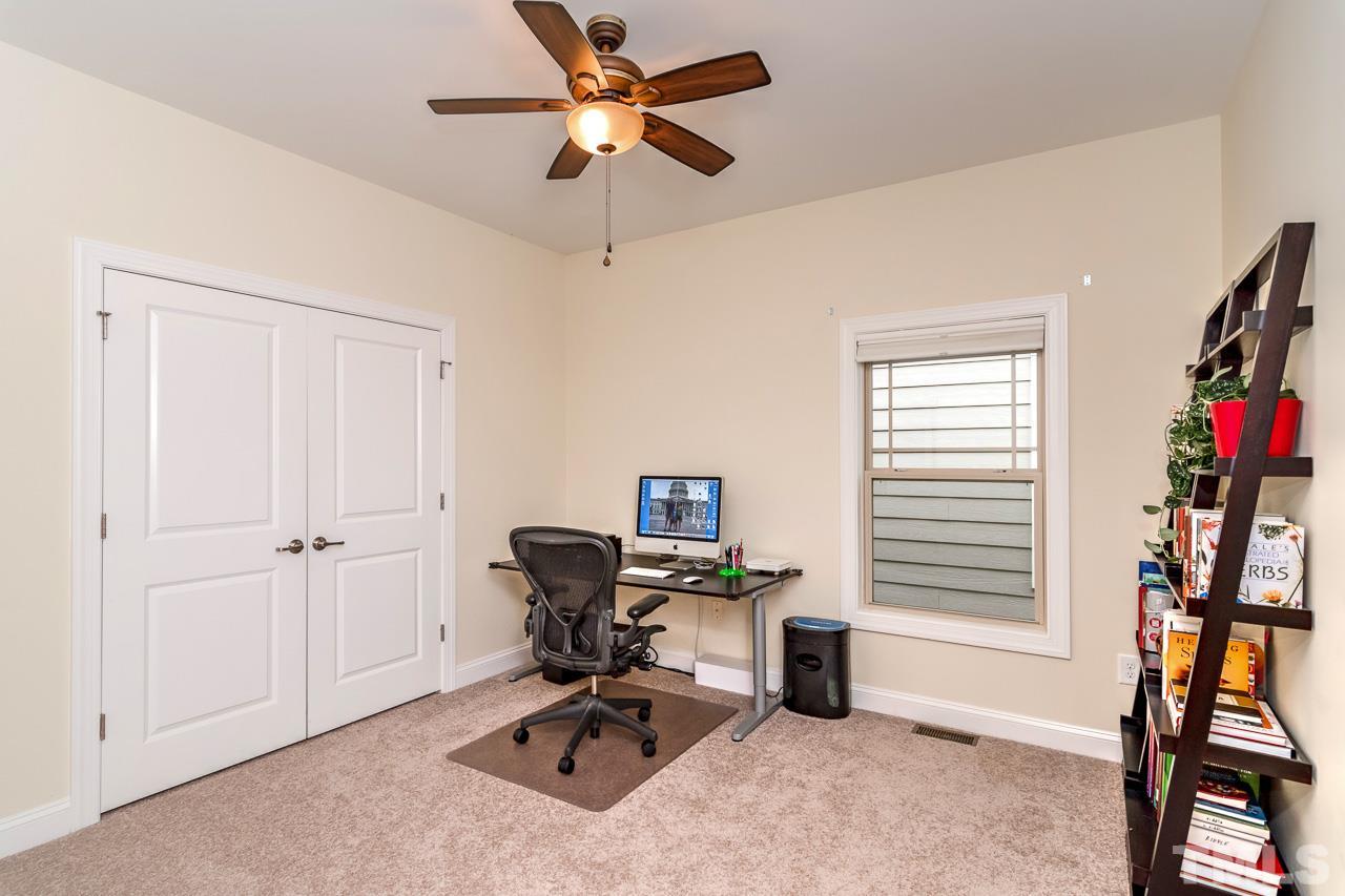 1409 Rodessa Run Raleigh, NC 27607 - Photo 19 of 25 a view of a workspace with furniture and a window