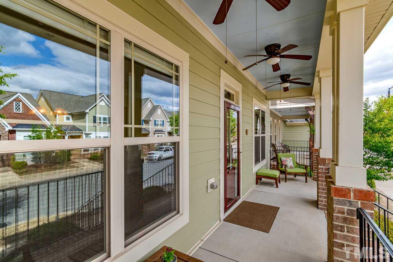 1409 Rodessa Run Raleigh, NC 27607 - Photo 3 of 25 a porch with a table and chairs