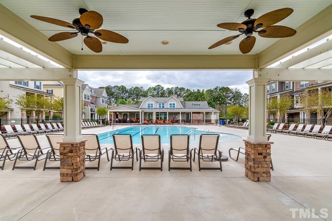 1409 Rodessa Run Raleigh, NC 27607 - Photo 23 of 25 a view of a patio with a table and chairs