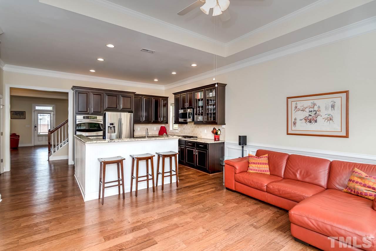 1409 Rodessa Run Raleigh, NC 27607 - Photo 8 of 25 a living room with furniture and kitchen view