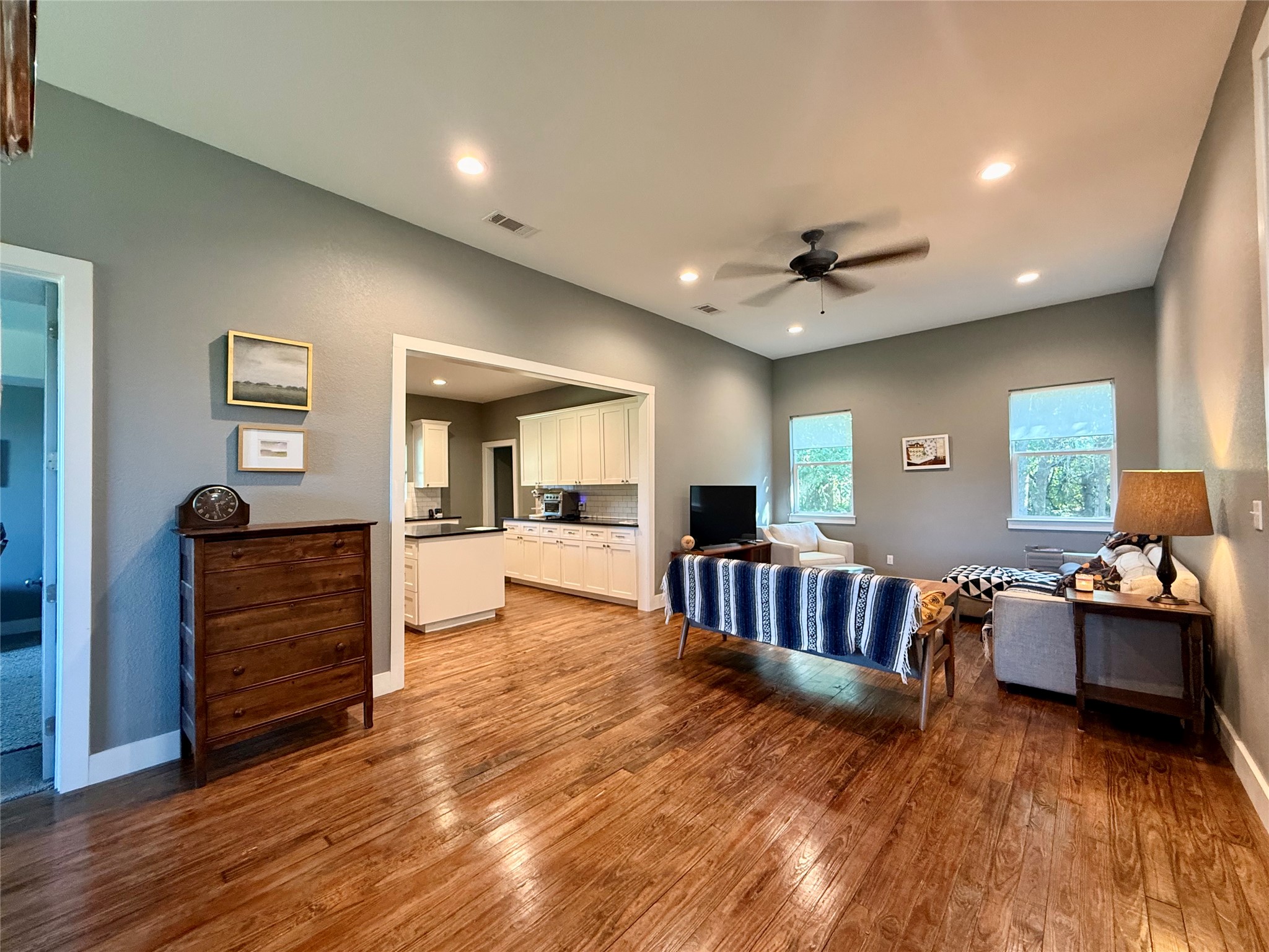 739 Pleasant Grove Road Elgin, TX 78621 - Photo 6 of 29 Spacious living area featuring wood-finish flooring, recessed lighting, and a ceiling fan