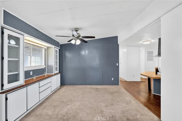 a kitchen with a stove and white cabinets