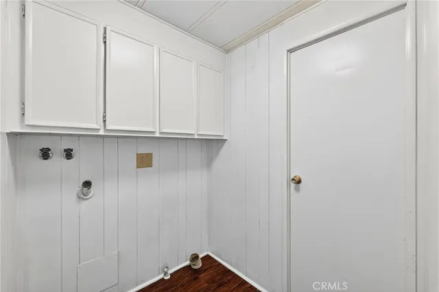a view of a room with a ceiling fan and entryway