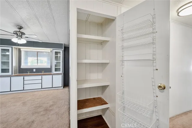 a bathroom with a sink mirror vanity and toilet