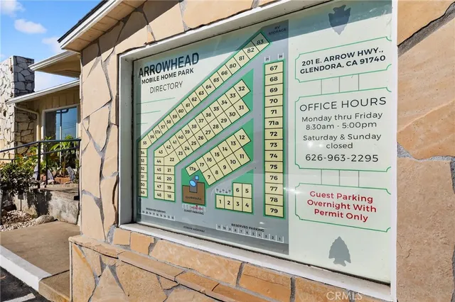a view of a swimming pool with a patio and a garden