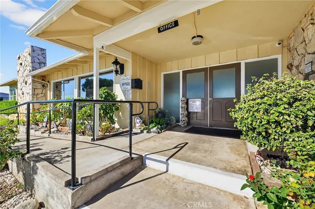 a view of a house with swimming pool yard and porch