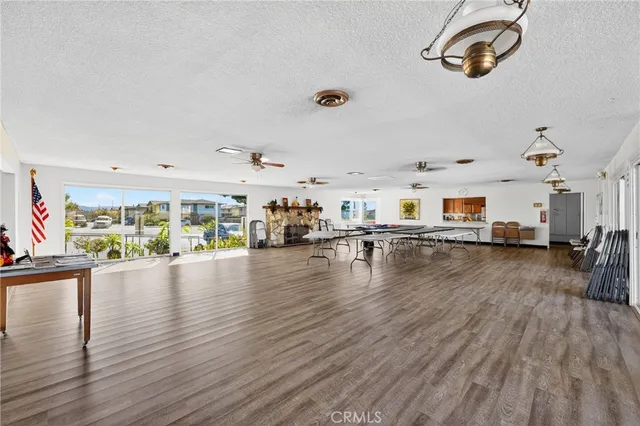 a patio with a table and chairs and a barbeque