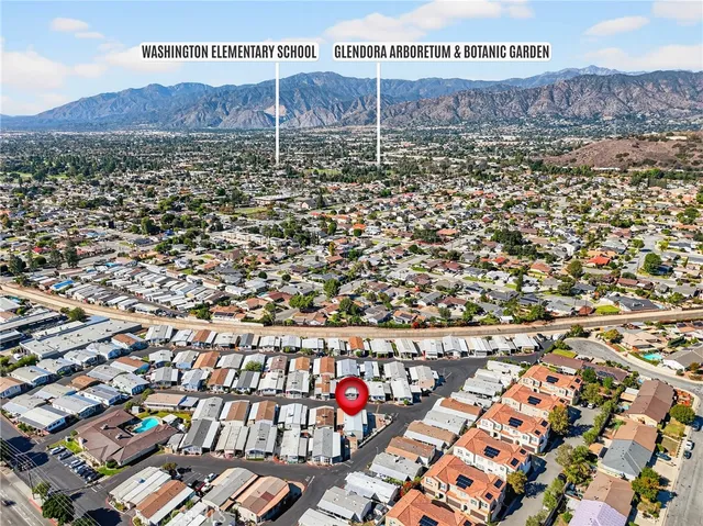 en empty room with windows and ceiling fan