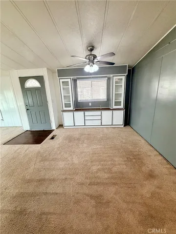 a terrace of a house with yard and seating area