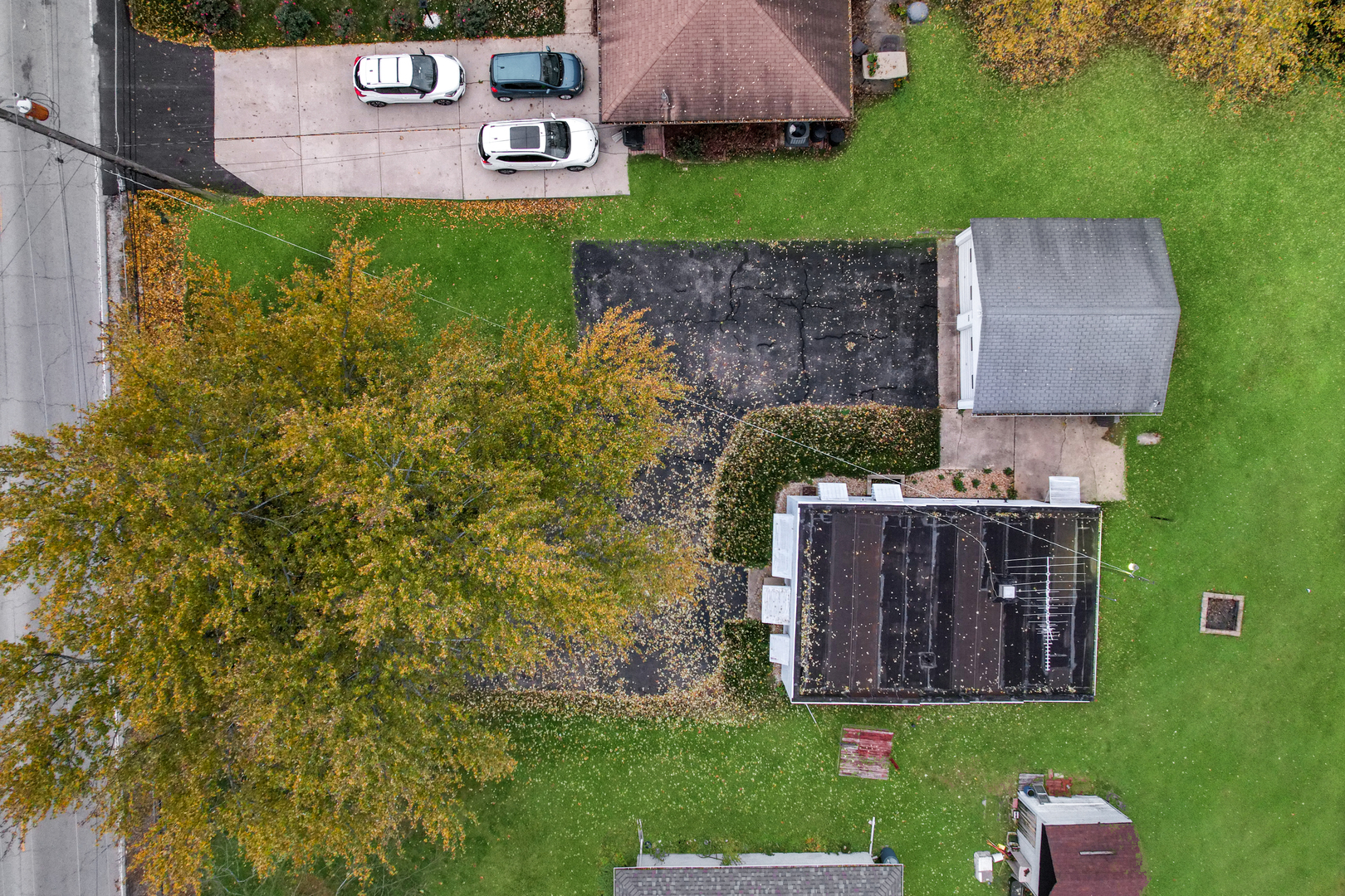 1641 Jericho Road Aurora, IL 60506 - Photo 17 of 17 an aerial view of a house with garden space and a street view