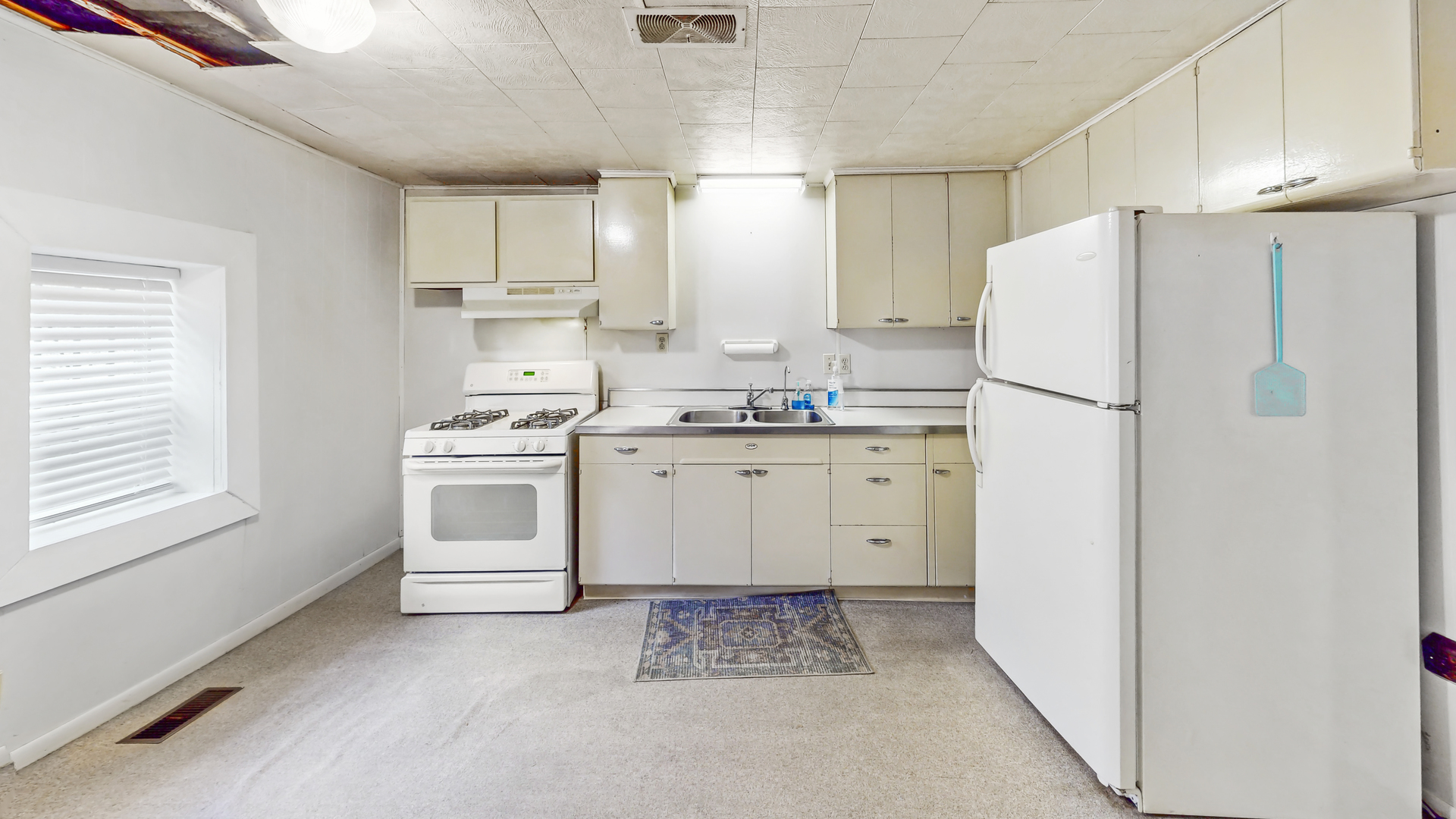 1641 Jericho Road Aurora, IL 60506 - Photo 6 of 17 a kitchen with white cabinets and white appliances